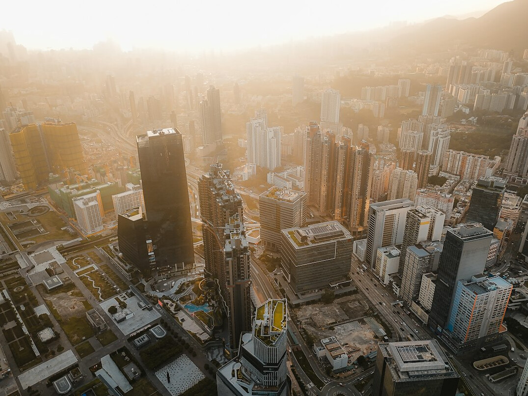Aerial view of a city skyline with soft morning light